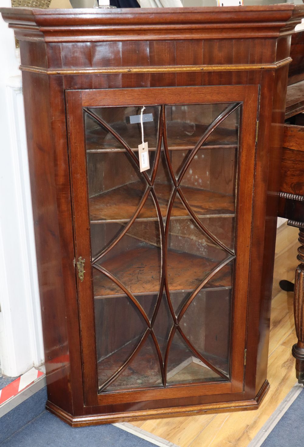 A George III glazed mahogany hanging corner cupboard, W.74cm, D.44cm, H.116cm